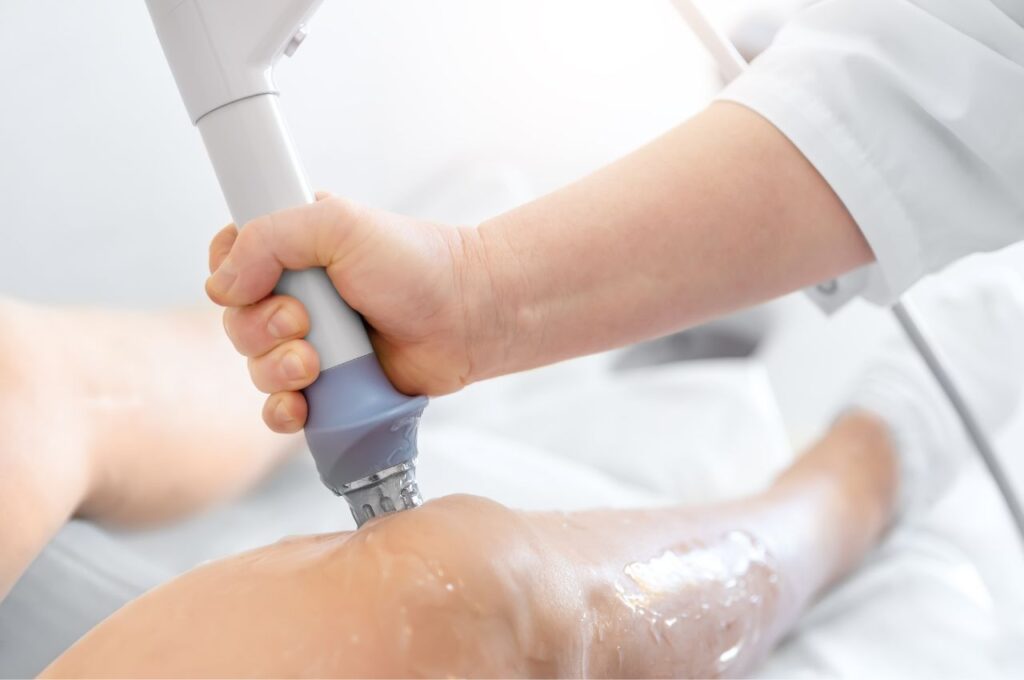 shockwave therapy being performed on a knee