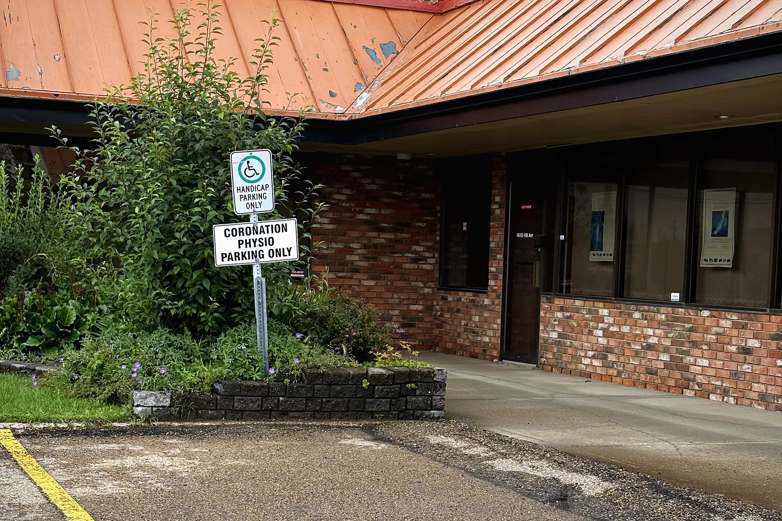 Reserved Coronation Physiotherapy parking beside the building