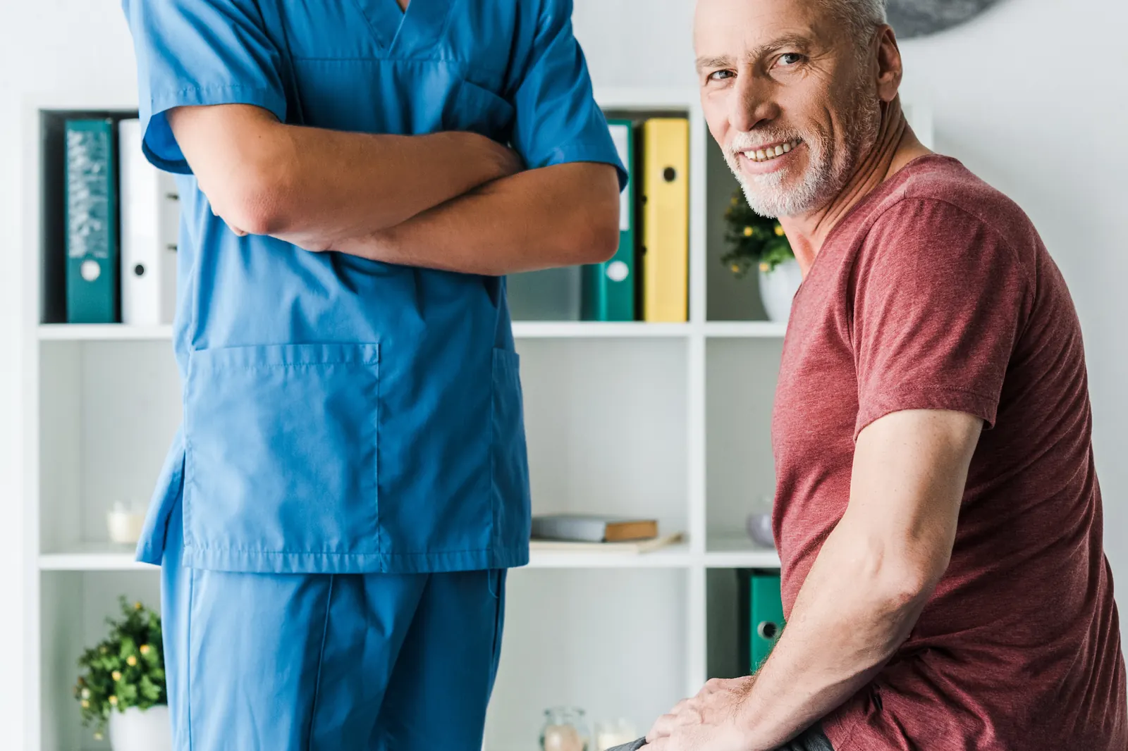 Physiotherapist reviewing recovery progress with a patient